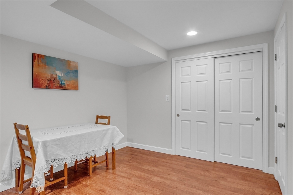 36 Flint Road Acton, MA 01720 - Photo 32 of 37 a view of a room with furniture and wooden floor