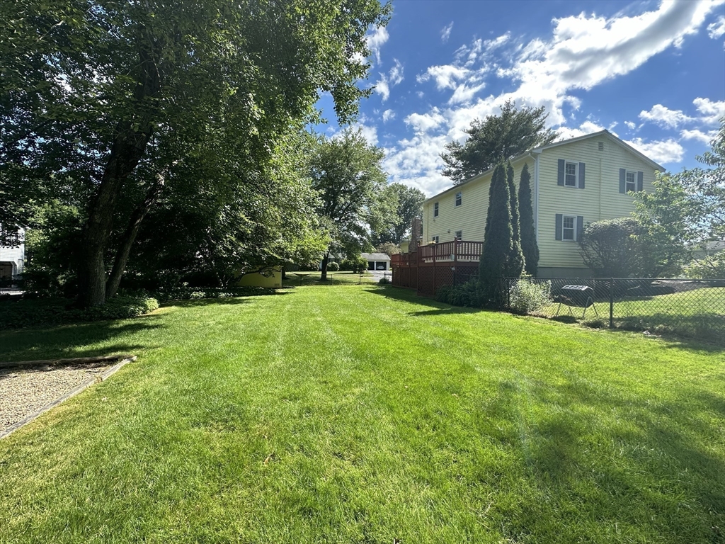 36 Flint Road Acton, MA 01720 - Photo 34 of 37 a view of a backyard with a garden