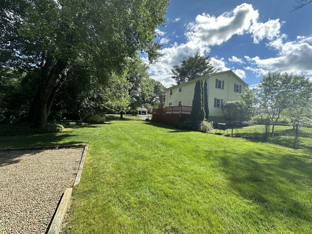 36 Flint Road Acton, MA 01720 - Photo 35 of 37 a view of a yard with plants and large trees