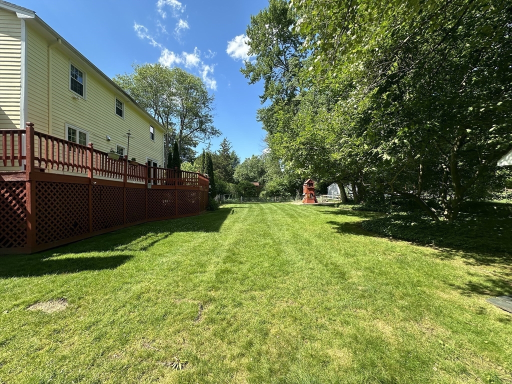 36 Flint Road Acton, MA 01720 - Photo 36 of 37 a view of backyard with green space