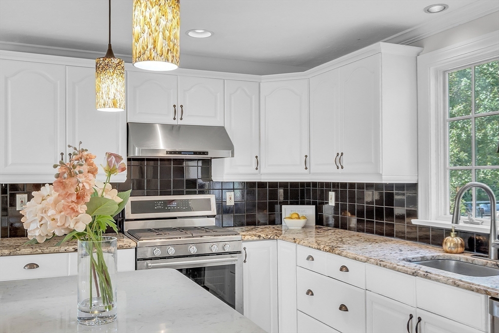 36 Flint Road Acton, MA 01720 - Photo 8 of 37 a kitchen with stainless steel appliances granite countertop a sink a stove and a white cabinets