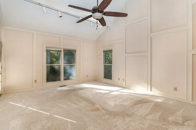 a view of an empty room with a window