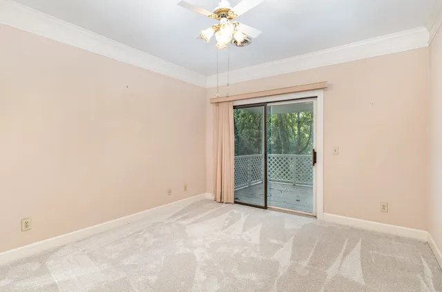 a view of a livingroom with a chandelier fan