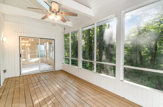 a view of a room with wooden floor and city view