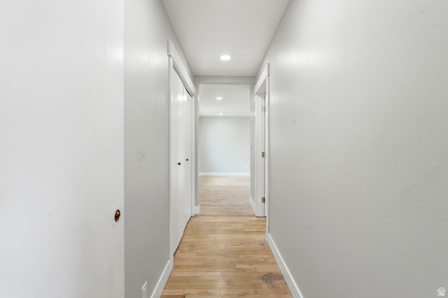 778 East 200 North Logan, UT 84321 - Photo 28 of 43 Hallway featuring recessed lighting, light wood-finish flooring, white walls, and bright white trim