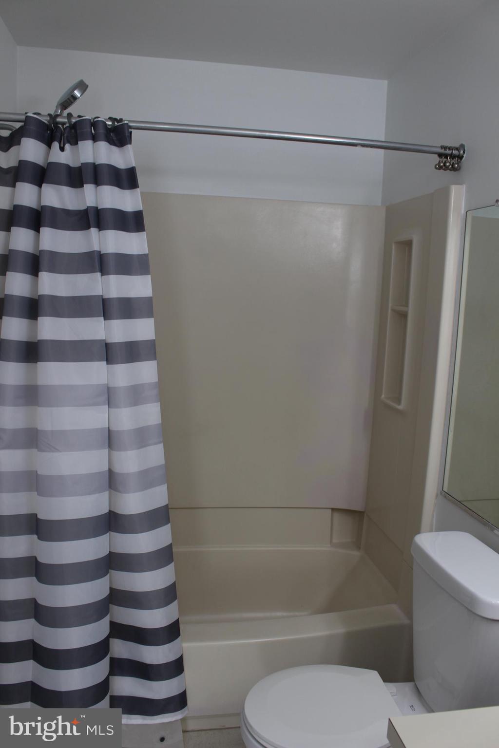 2614 C Auburn Court Mount Laurel, NJ 08054 - Photo 10 of 26 a bathroom with a shower and a toilet