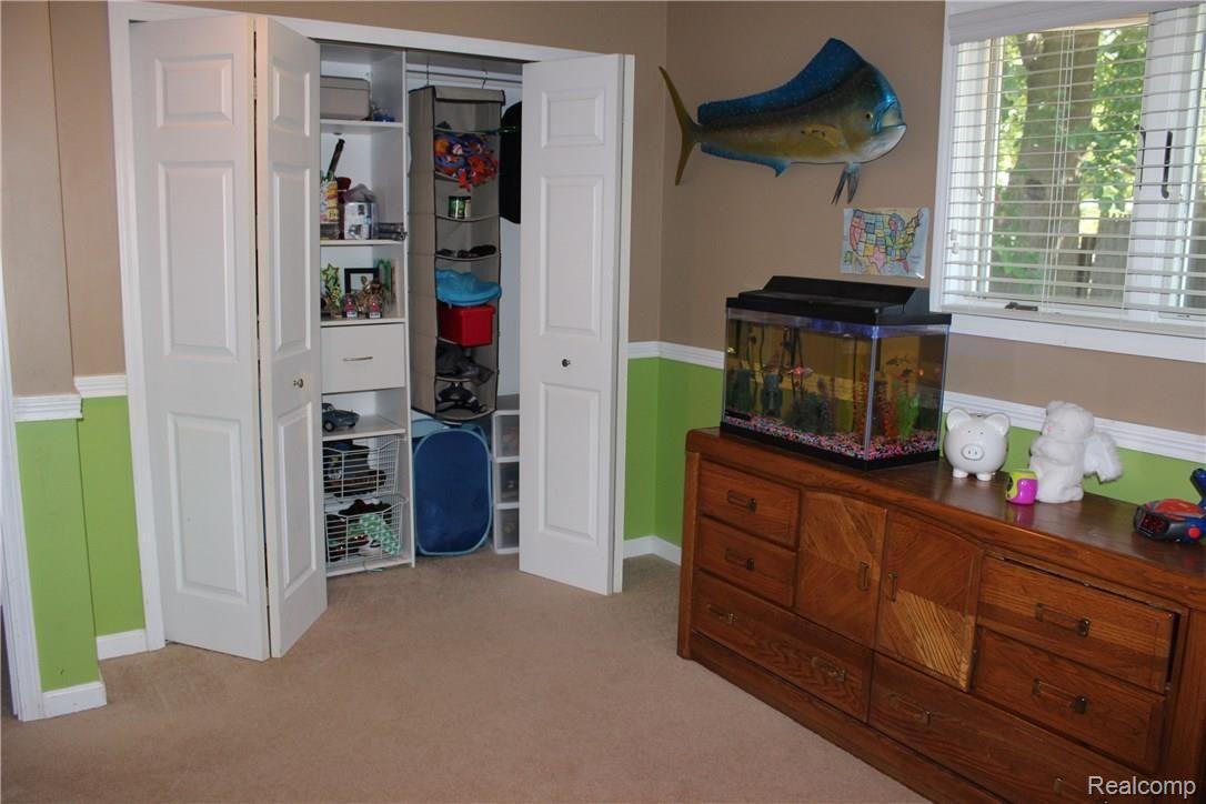 3460 Mann Road Clarkston, MI 48346 - Photo 13 of 25 Bedroom 2 with closet organizers