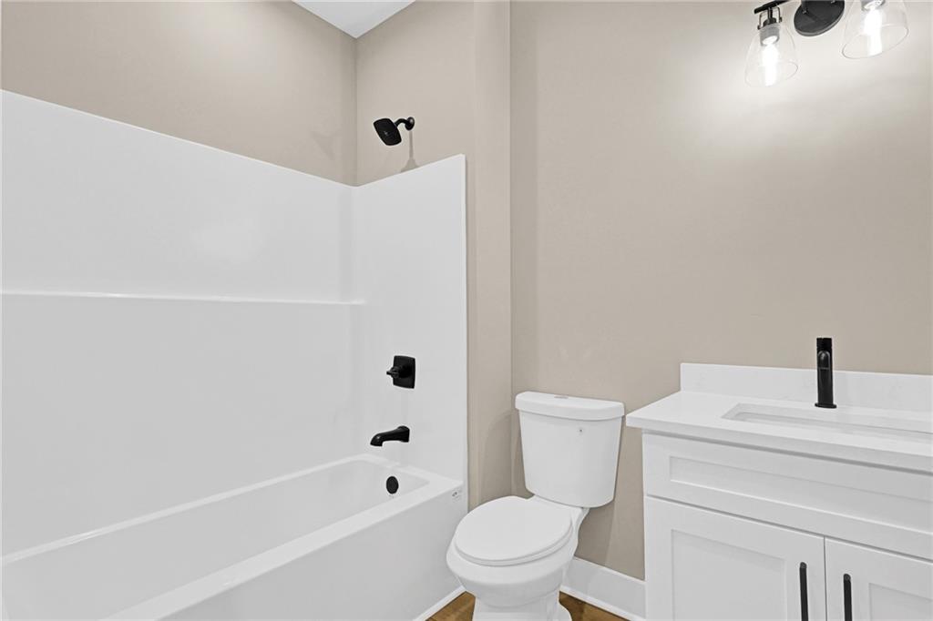 507 North Ridge Road Barnesville, GA 30204 - Photo 11 of 18 a bathroom with a sink a toilet and shower