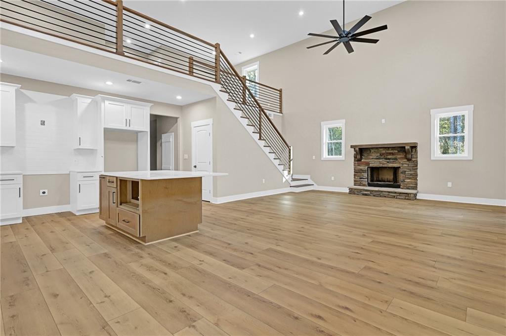 507 North Ridge Road Barnesville, GA 30204 - Photo 2 of 18 a view of a livingroom with wooden floor and a ceiling fan