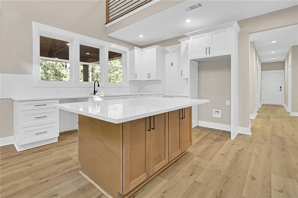 507 North Ridge Road Barnesville, GA 30204 - Photo 5 of 18 a spacious bathroom with a granite countertop sink mirror and a bathtub