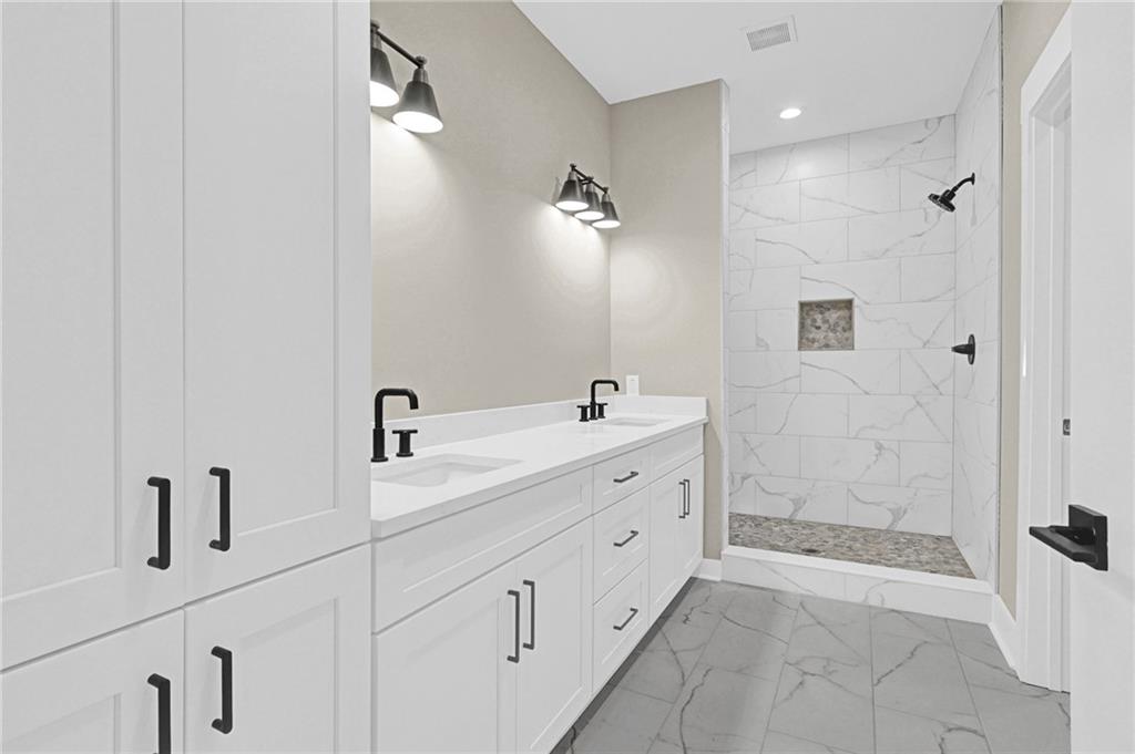 507 North Ridge Road Barnesville, GA 30204 - Photo 9 of 18 a spacious bathroom with double sink and a shower
