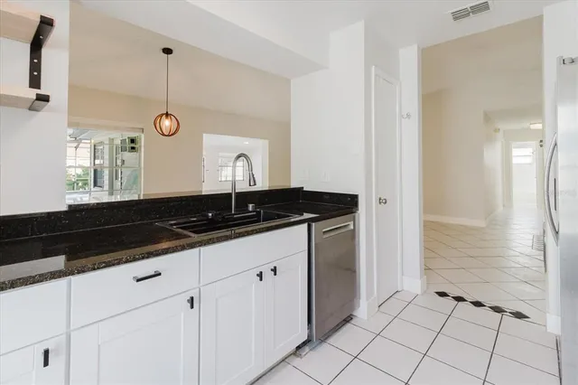 a bedroom with a bed and a chair