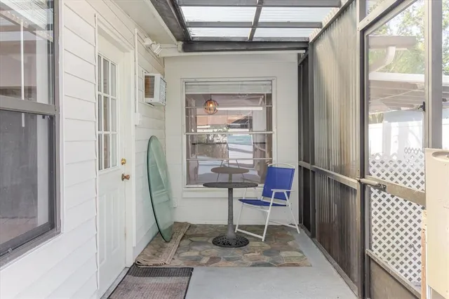 a view of an empty room with a white walls