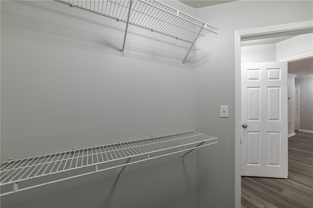 970 Sidney Marcus Boulevard Northeast, Unit 1204 Atlanta, GA 30324 - Photo 41 of 60 a view of a room with racks on the wall