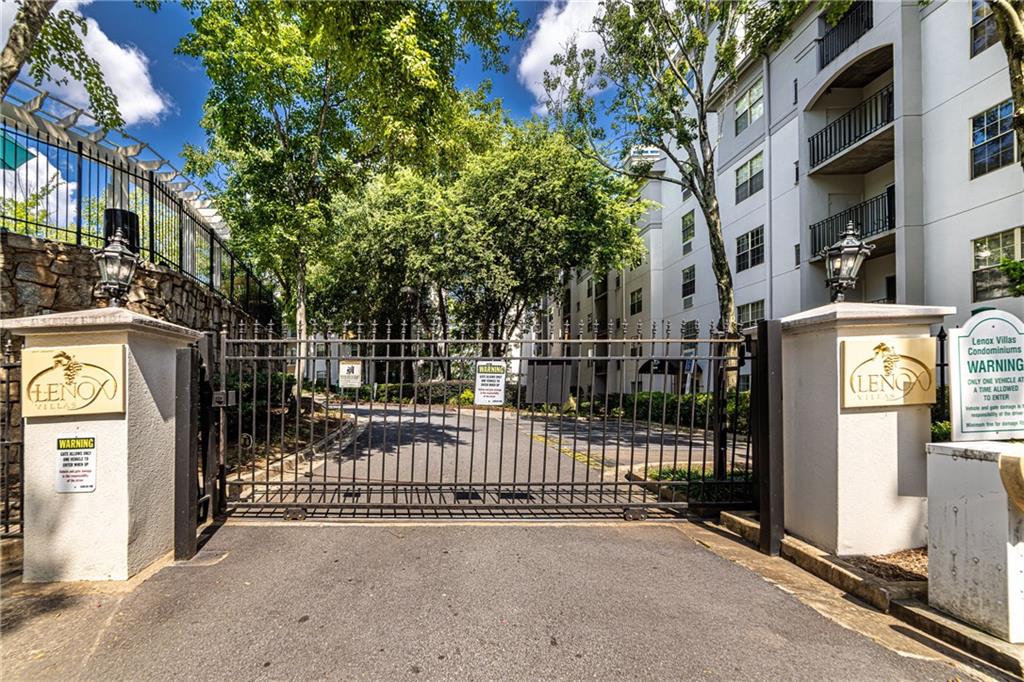 970 Sidney Marcus Boulevard Northeast, Unit 1204 Atlanta, GA 30324 - Photo 6 of 60 a view of a street with brick wall in front of it