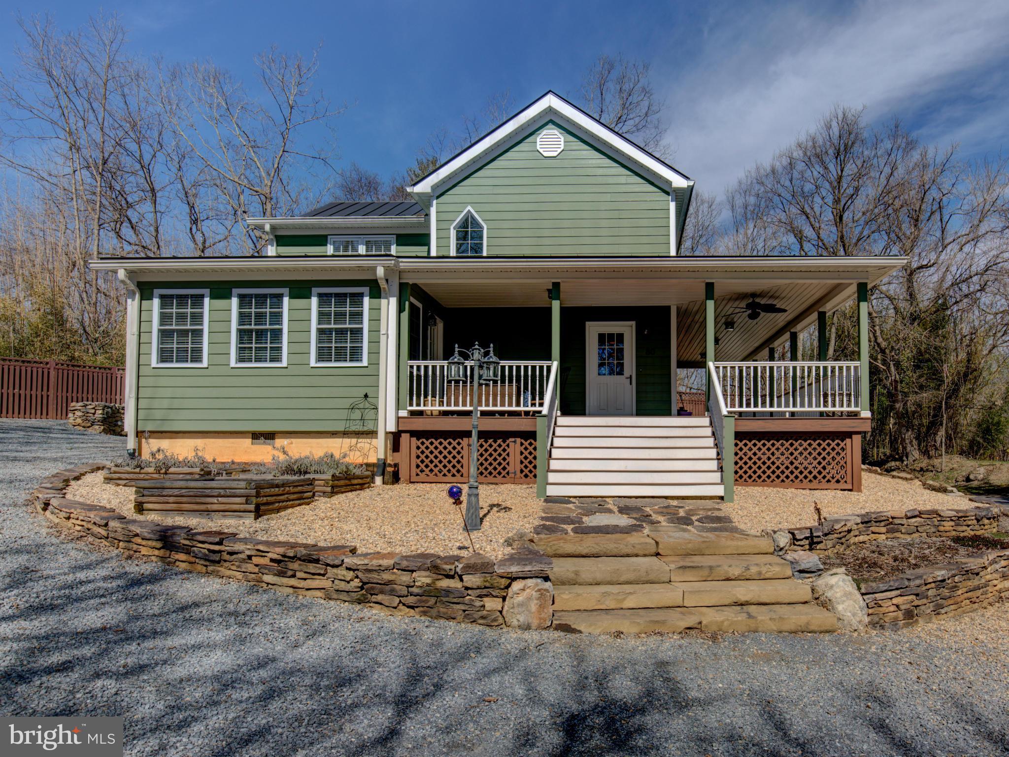 80 Rocky Bank Road Boyce, VA 22620 - Photo 1 of 30 a front view of a house with garden