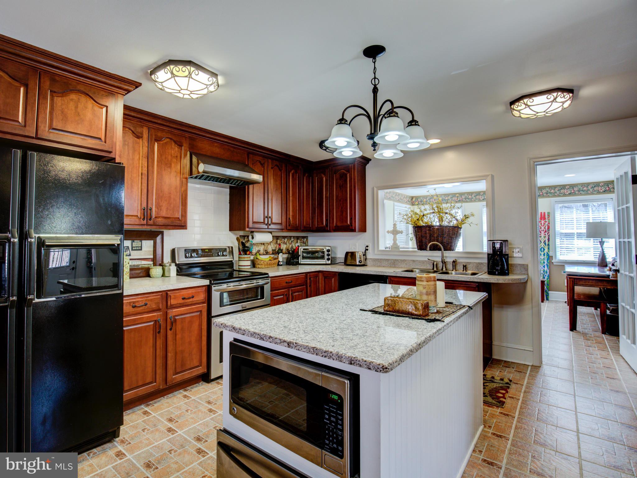 80 Rocky Bank Road Boyce, VA 22620 - Photo 14 of 30 a kitchen with a refrigerator a stove a sink and dishwasher