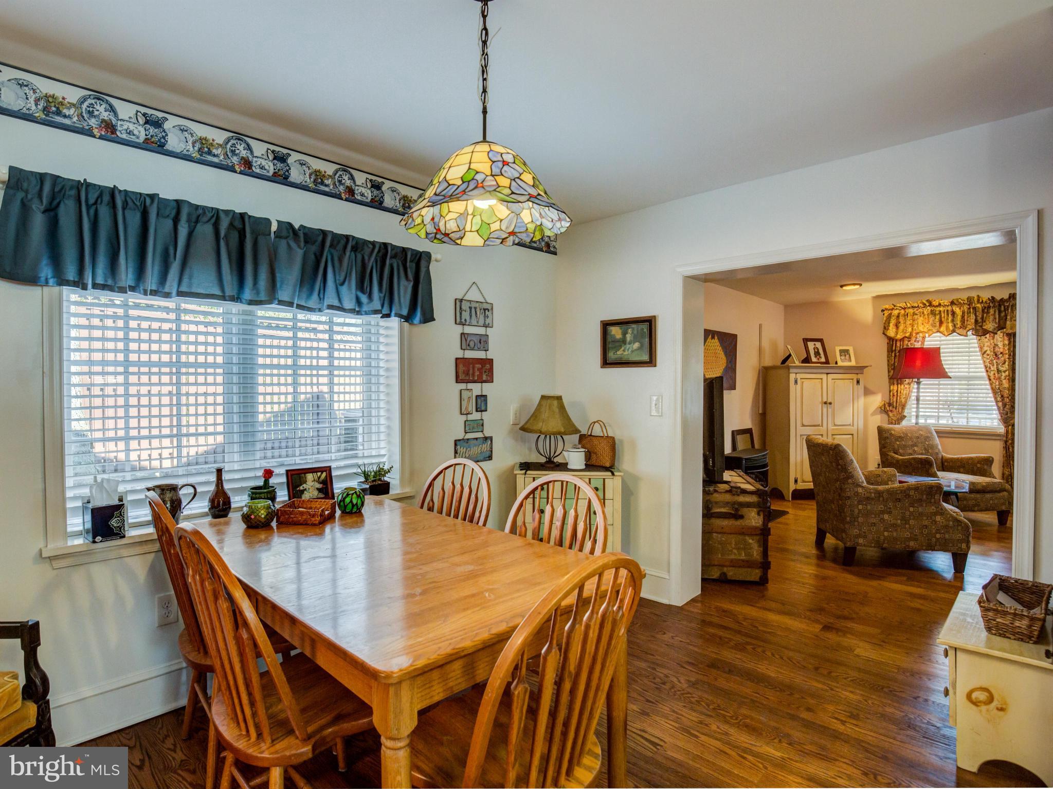 80 Rocky Bank Road Boyce, VA 22620 - Photo 15 of 30 a view of a dining room with furniture a chandelier and wooden floor