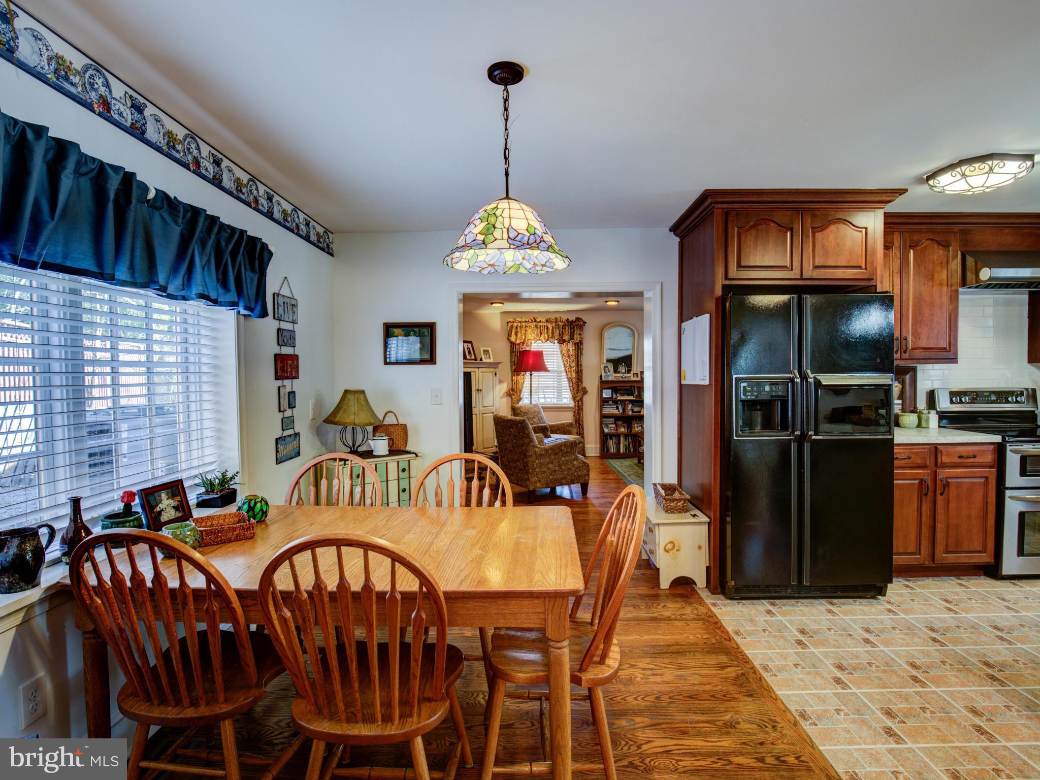 80 Rocky Bank Road Boyce, VA 22620 - Photo 16 of 30 a dining room with furniture window and wooden floor