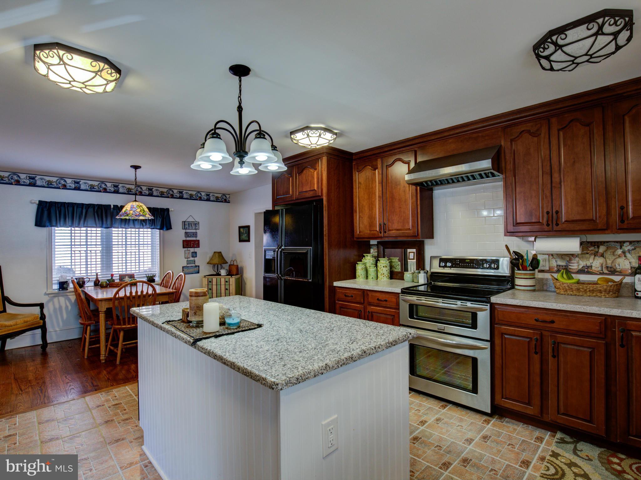 80 Rocky Bank Road Boyce, VA 22620 - Photo 17 of 30 a kitchen with a stove and a refrigerator
