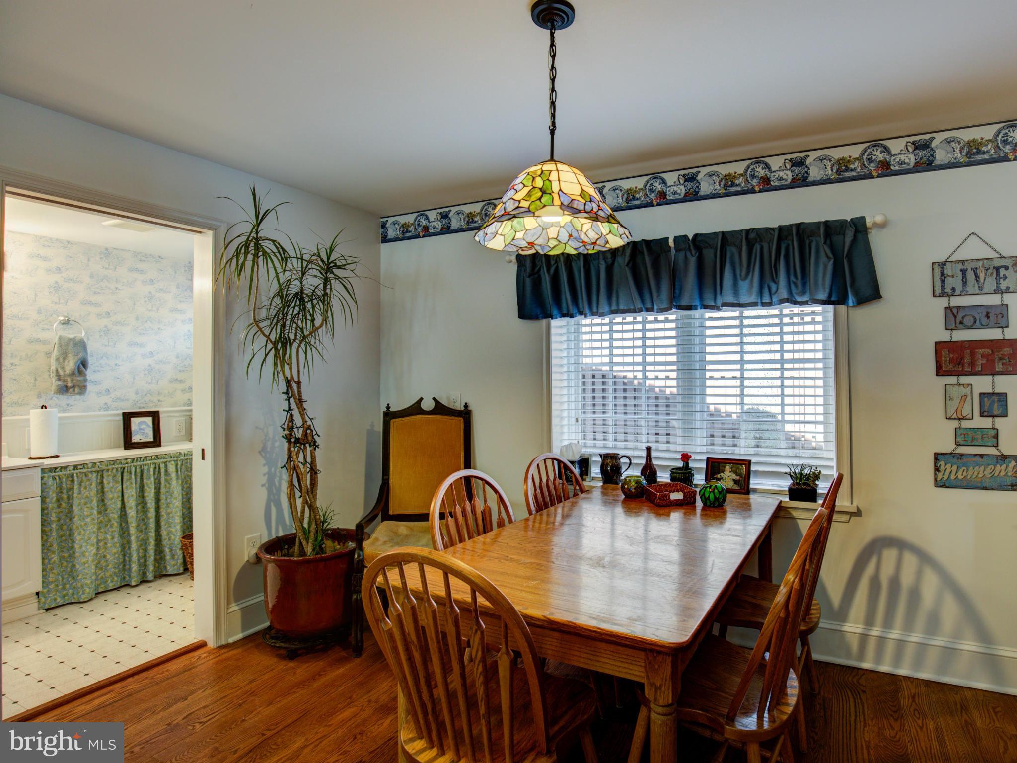 80 Rocky Bank Road Boyce, VA 22620 - Photo 19 of 30 a view of a dining room with furniture window and wooden floor