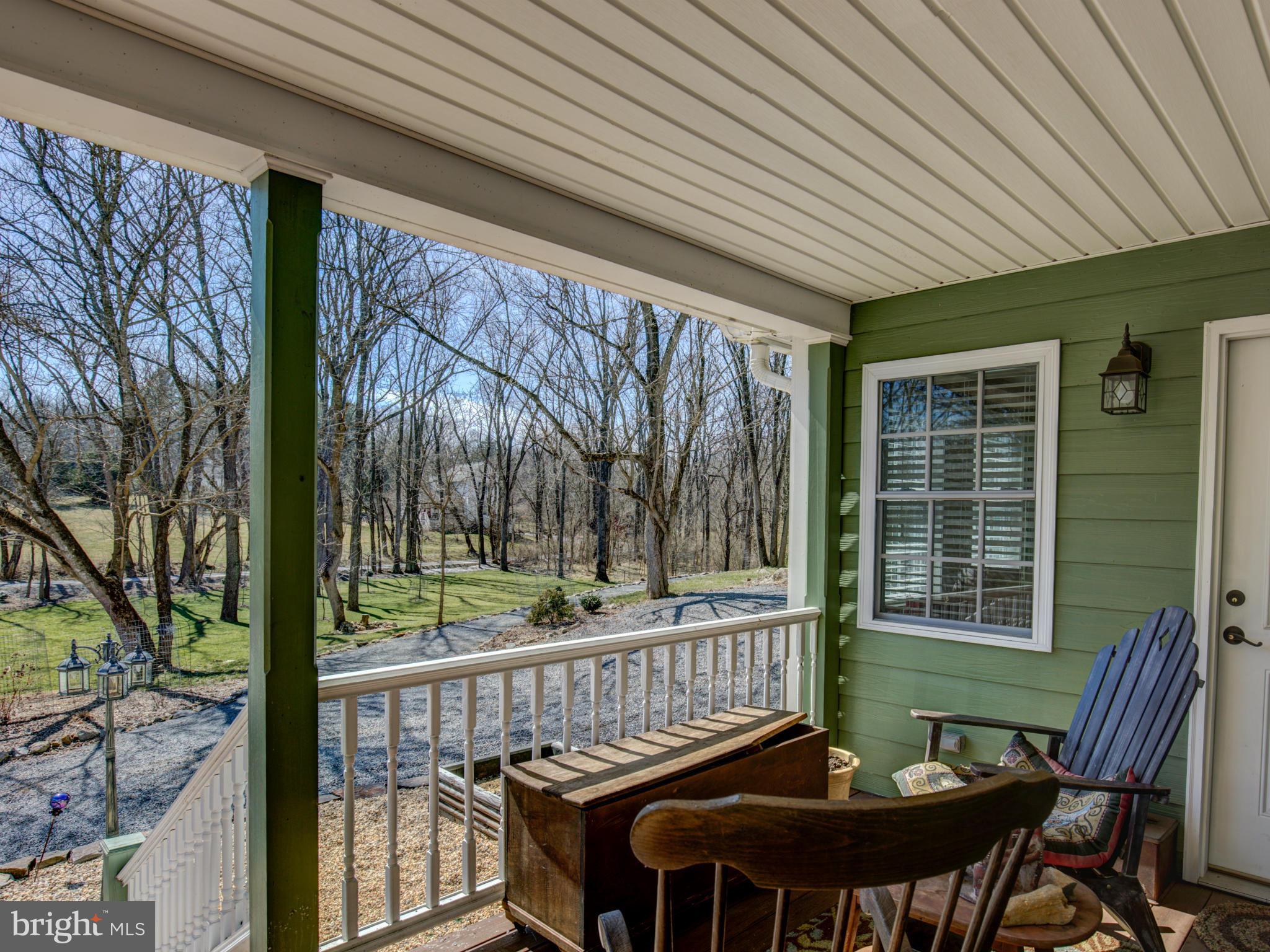 80 Rocky Bank Road Boyce, VA 22620 - Photo 2 of 30 a view of a chairs and table in the balcony