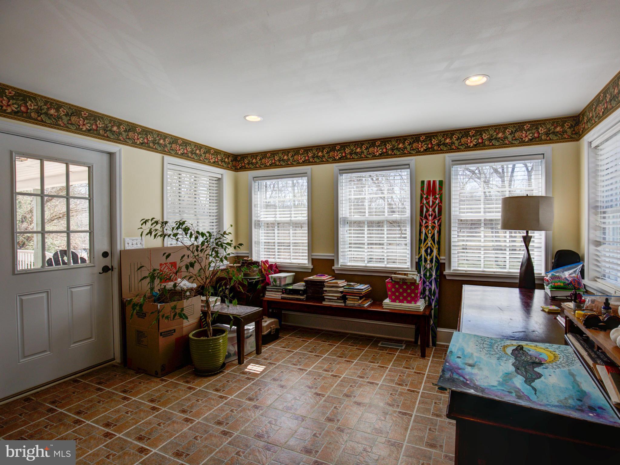 80 Rocky Bank Road Boyce, VA 22620 - Photo 22 of 30 a living room with furniture and a large window