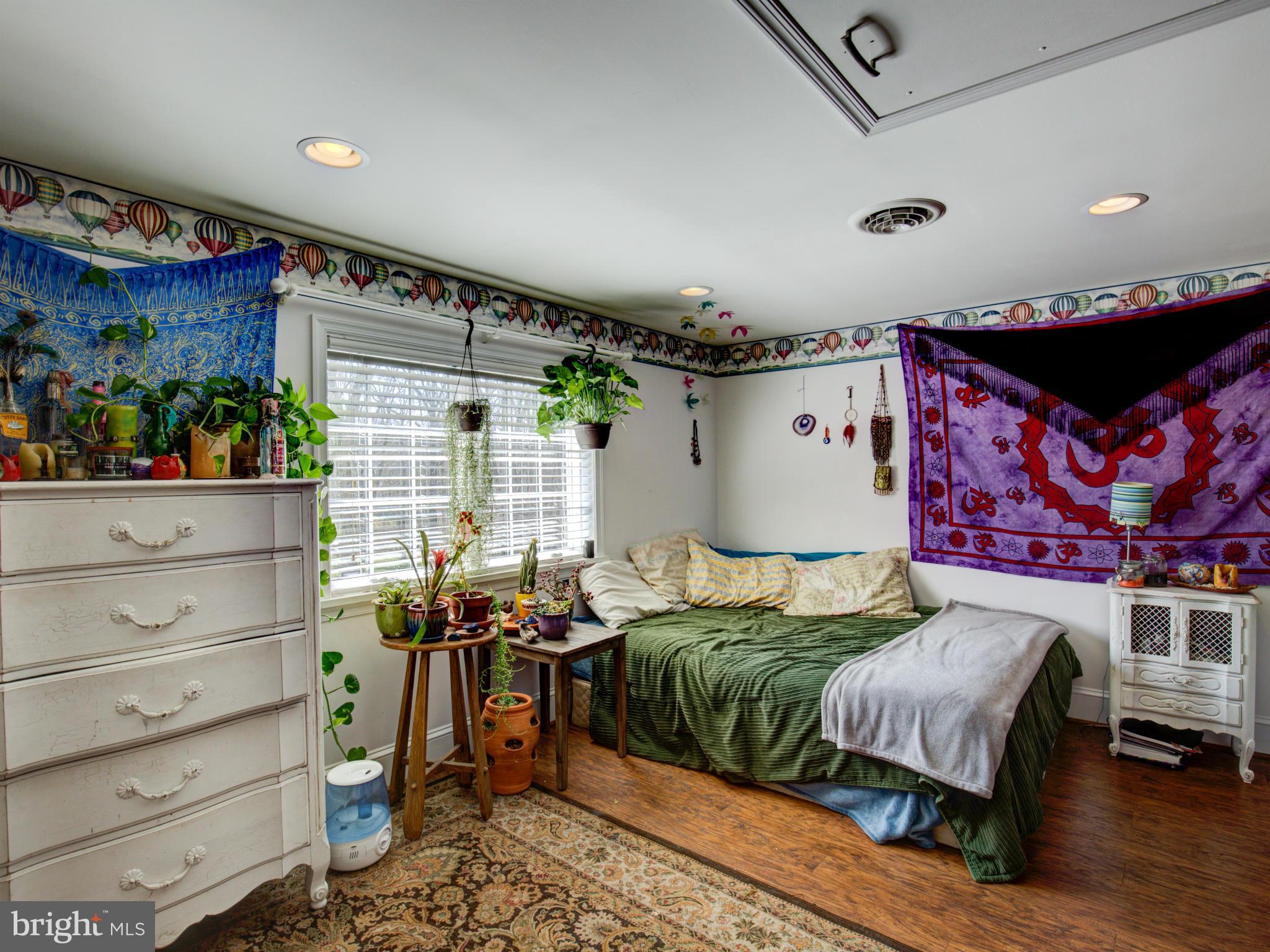 80 Rocky Bank Road Boyce, VA 22620 - Photo 24 of 30 a bedroom with a bed and wooden floor