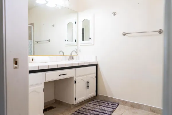 a bathroom with a sink and a mirror
