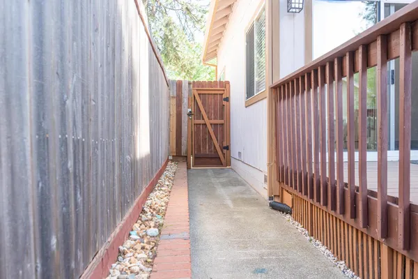 a view of a balcony with wooden floor