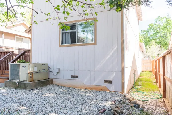 a view of house with backyard
