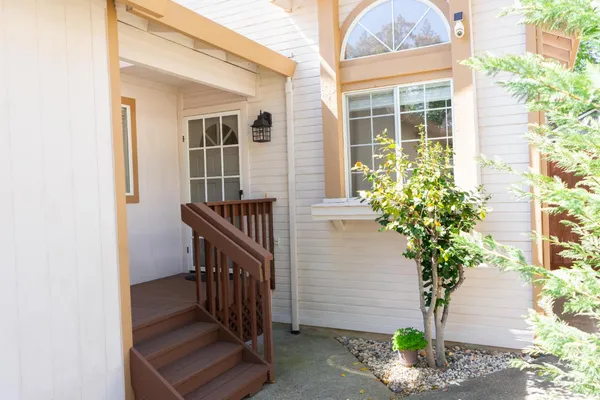 a view of balcony with wooden floor