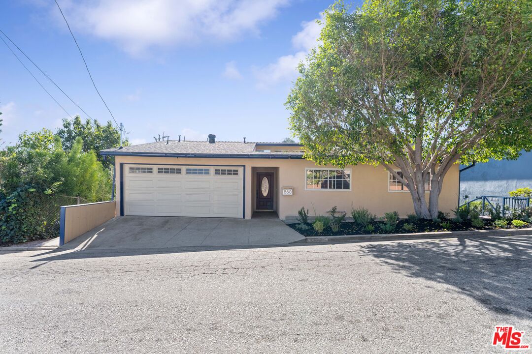 880 Oneonta Drive Los Angeles, CA 90065 - Photo 1 of 1 a view of a house with a yard and garage