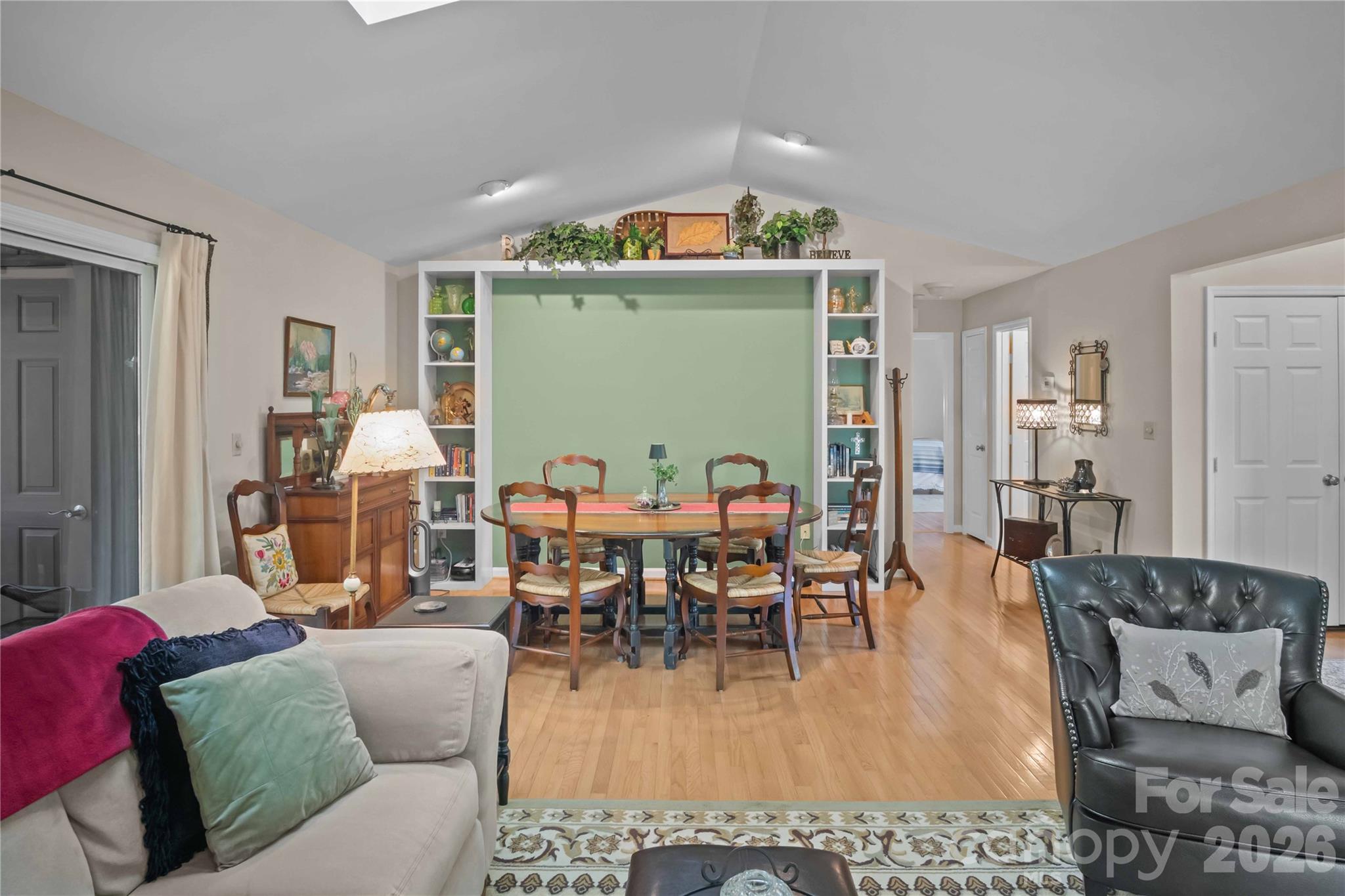 335 Melrose Avenue, Unit 103 Tryon, NC 28782 - Photo 11 of 38 a living room with furniture and a wooden floor
