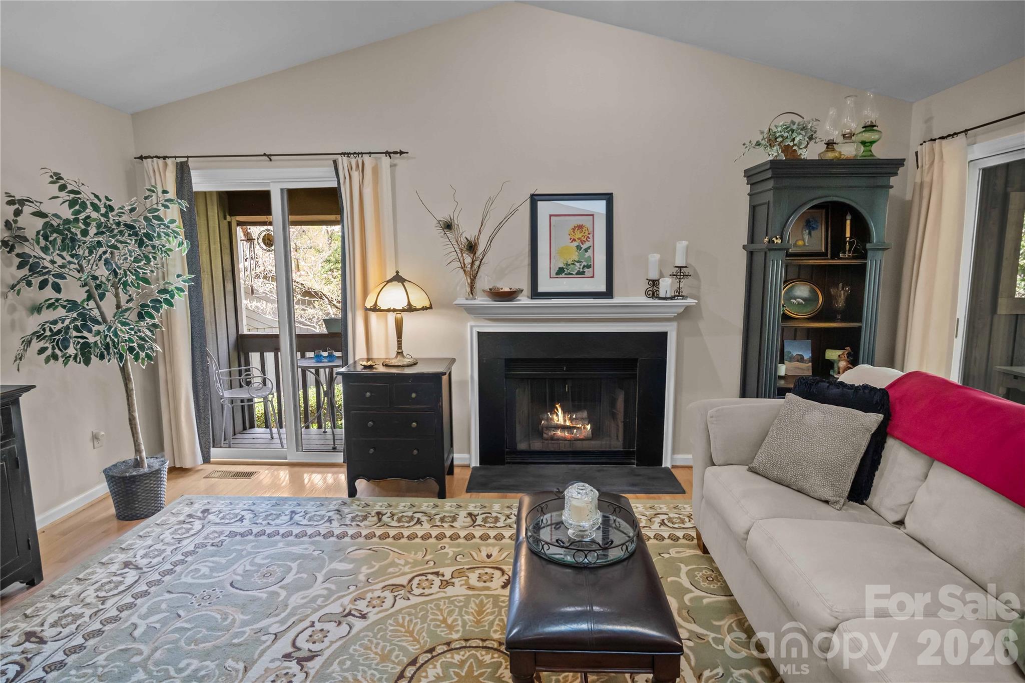 335 Melrose Avenue, Unit 103 Tryon, NC 28782 - Photo 12 of 38 a living room with furniture and a fireplace