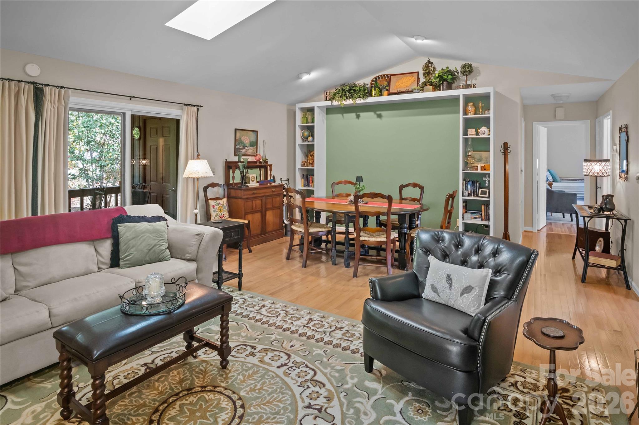 335 Melrose Avenue, Unit 103 Tryon, NC 28782 - Photo 14 of 38 a living room with furniture and a window