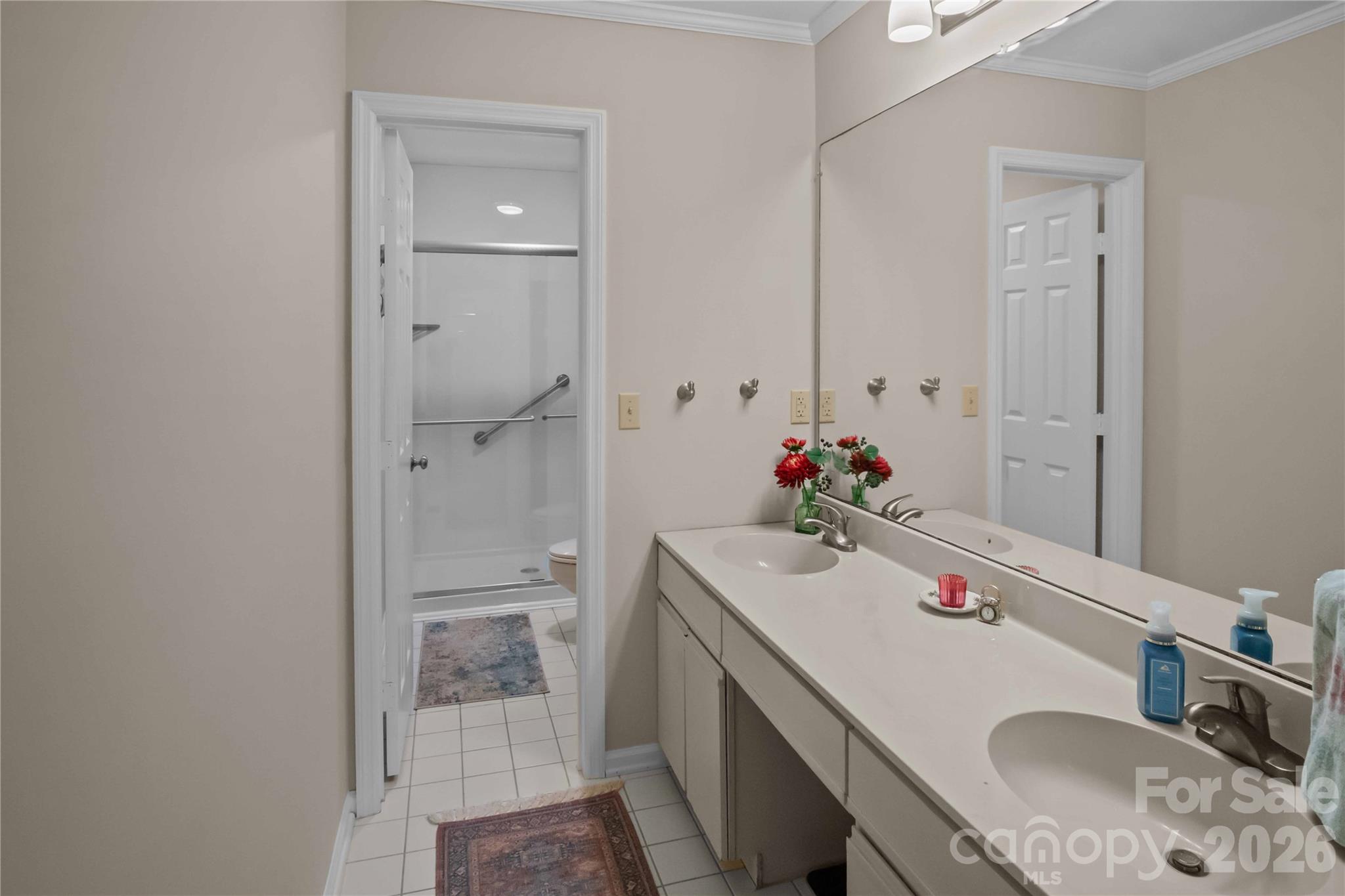 335 Melrose Avenue, Unit 103 Tryon, NC 28782 - Photo 21 of 38 a bathroom with a sink toilet and shower