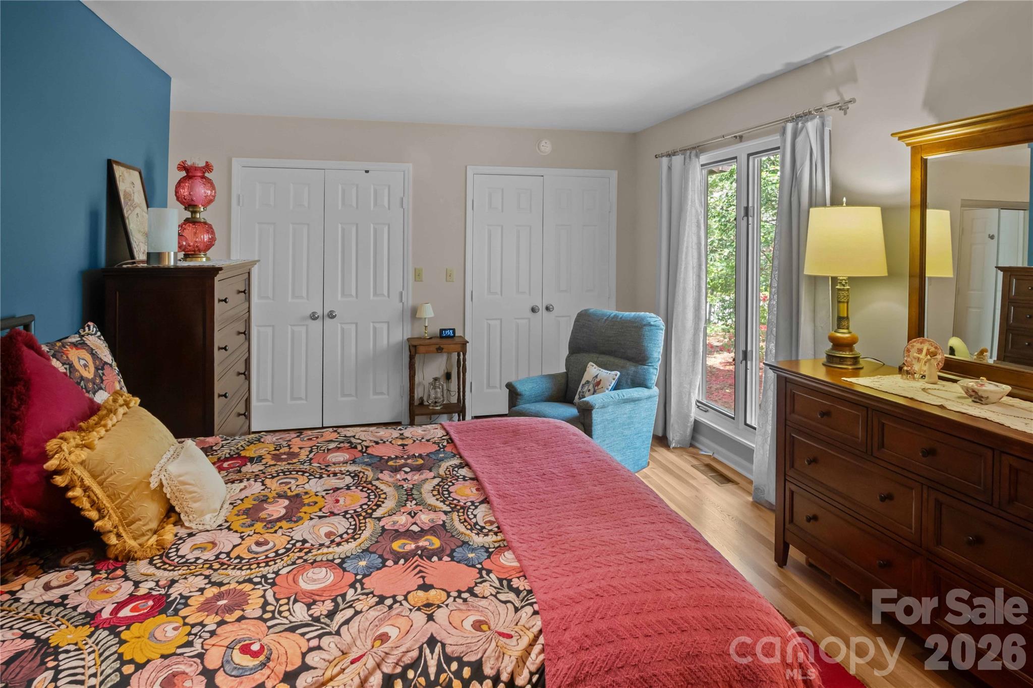 335 Melrose Avenue, Unit 103 Tryon, NC 28782 - Photo 25 of 38 a bedroom with a bed and wooden floor