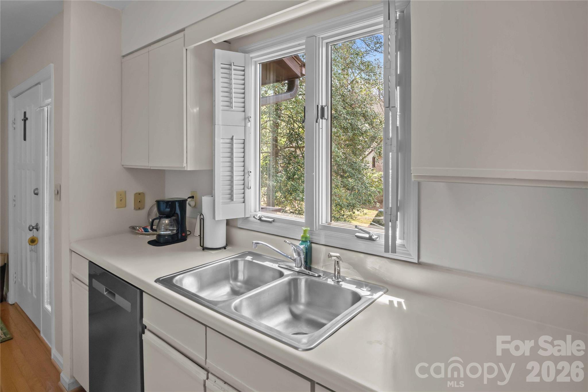 335 Melrose Avenue, Unit 103 Tryon, NC 28782 - Photo 29 of 38 a kitchen with a sink and a window