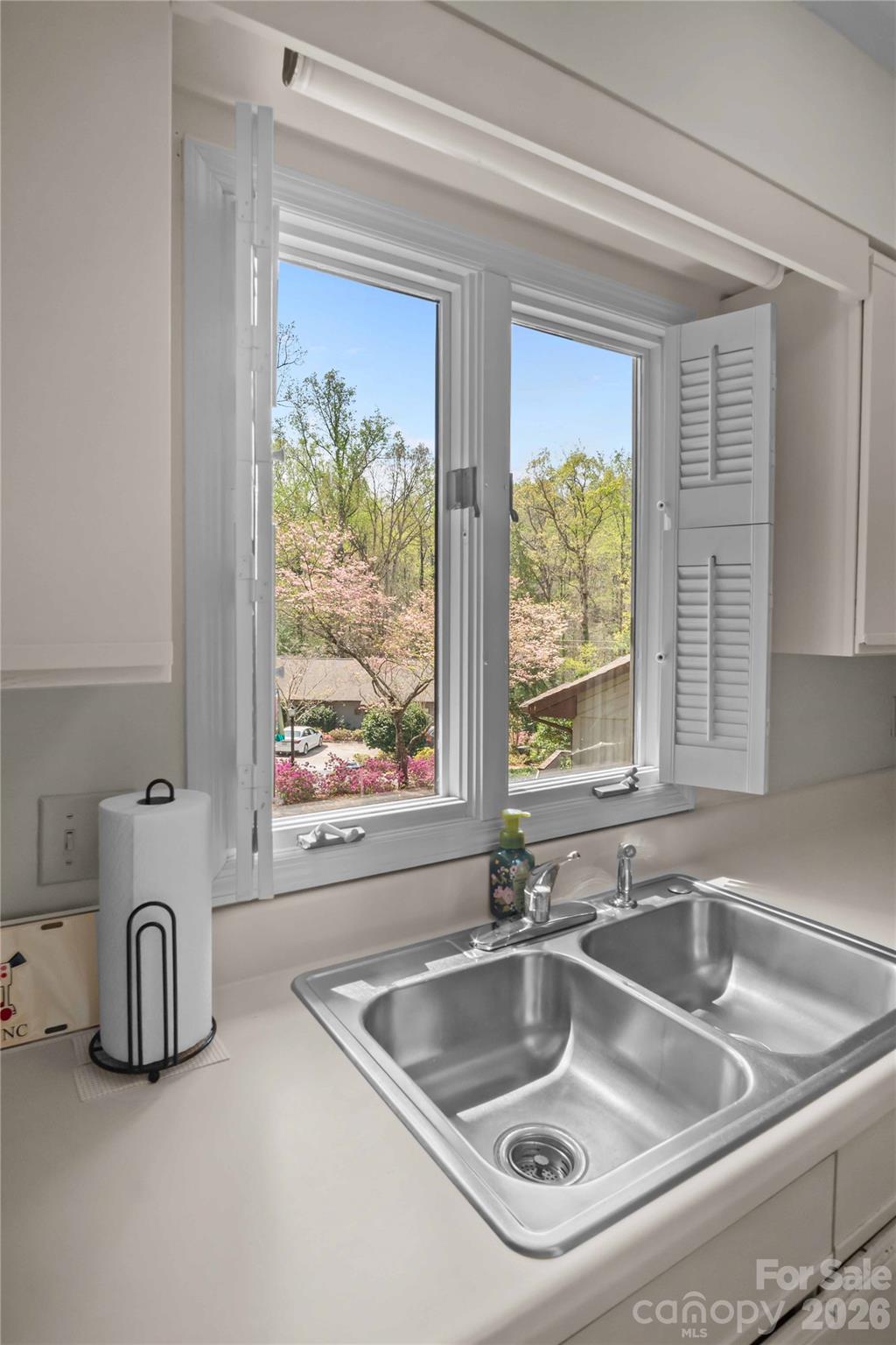335 Melrose Avenue, Unit 103 Tryon, NC 28782 - Photo 30 of 38 a kitchen with a sink and a large window