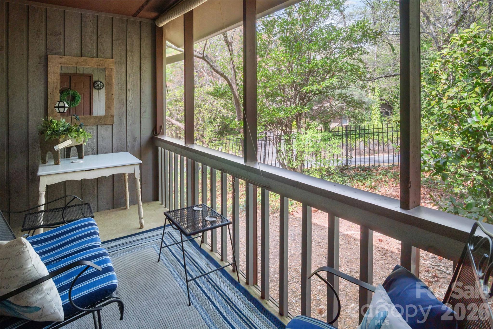 335 Melrose Avenue, Unit 103 Tryon, NC 28782 - Photo 37 of 38 a view of a city from a balcony with furniture