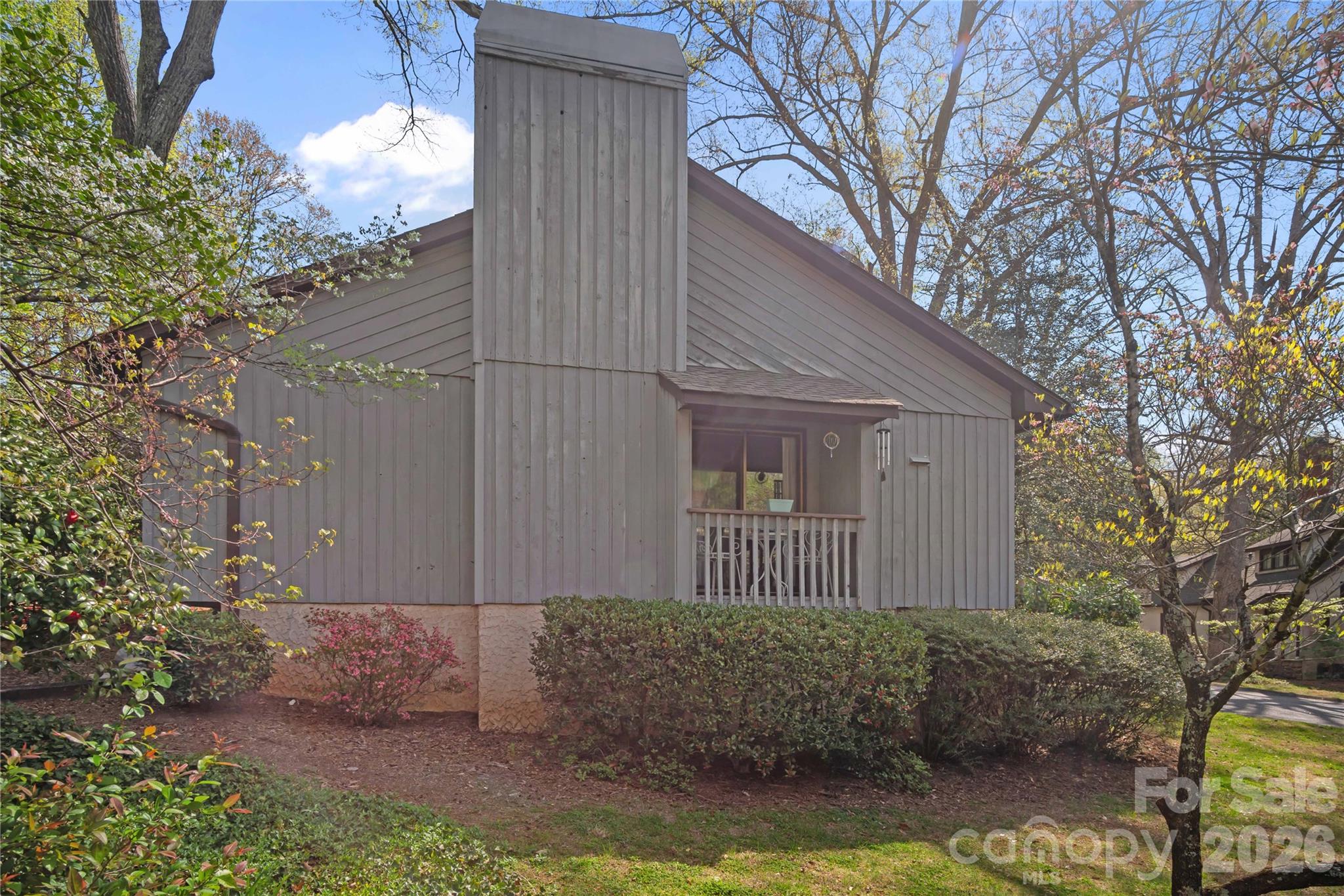 335 Melrose Avenue, Unit 103 Tryon, NC 28782 - Photo 6 of 38 a view of a house with a yard