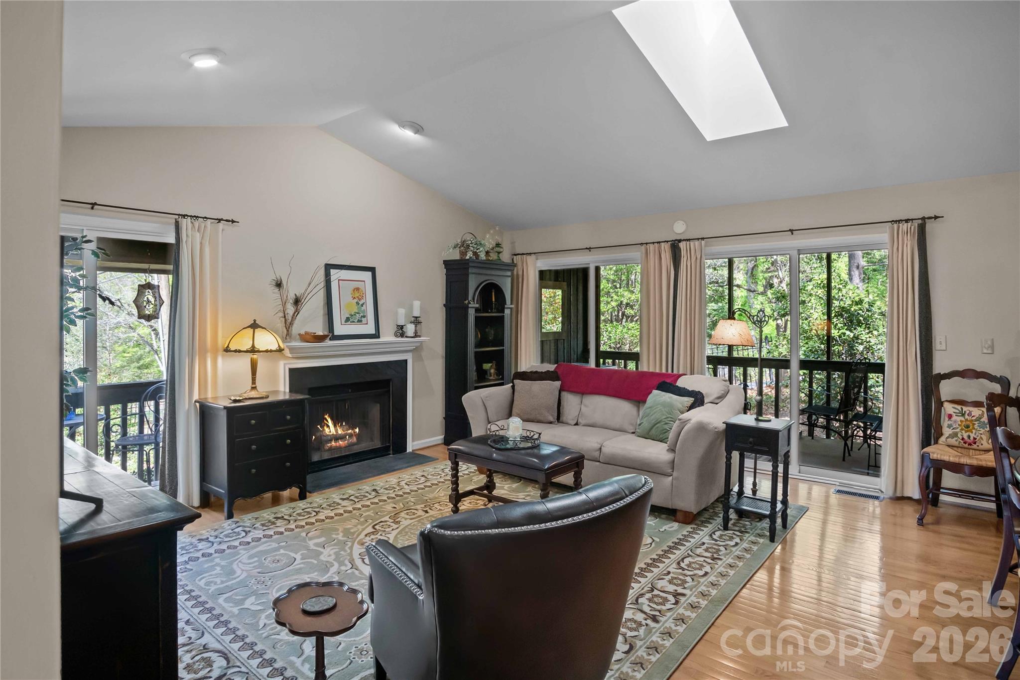 335 Melrose Avenue, Unit 103 Tryon, NC 28782 - Photo 8 of 38 a living room with furniture and a fireplace