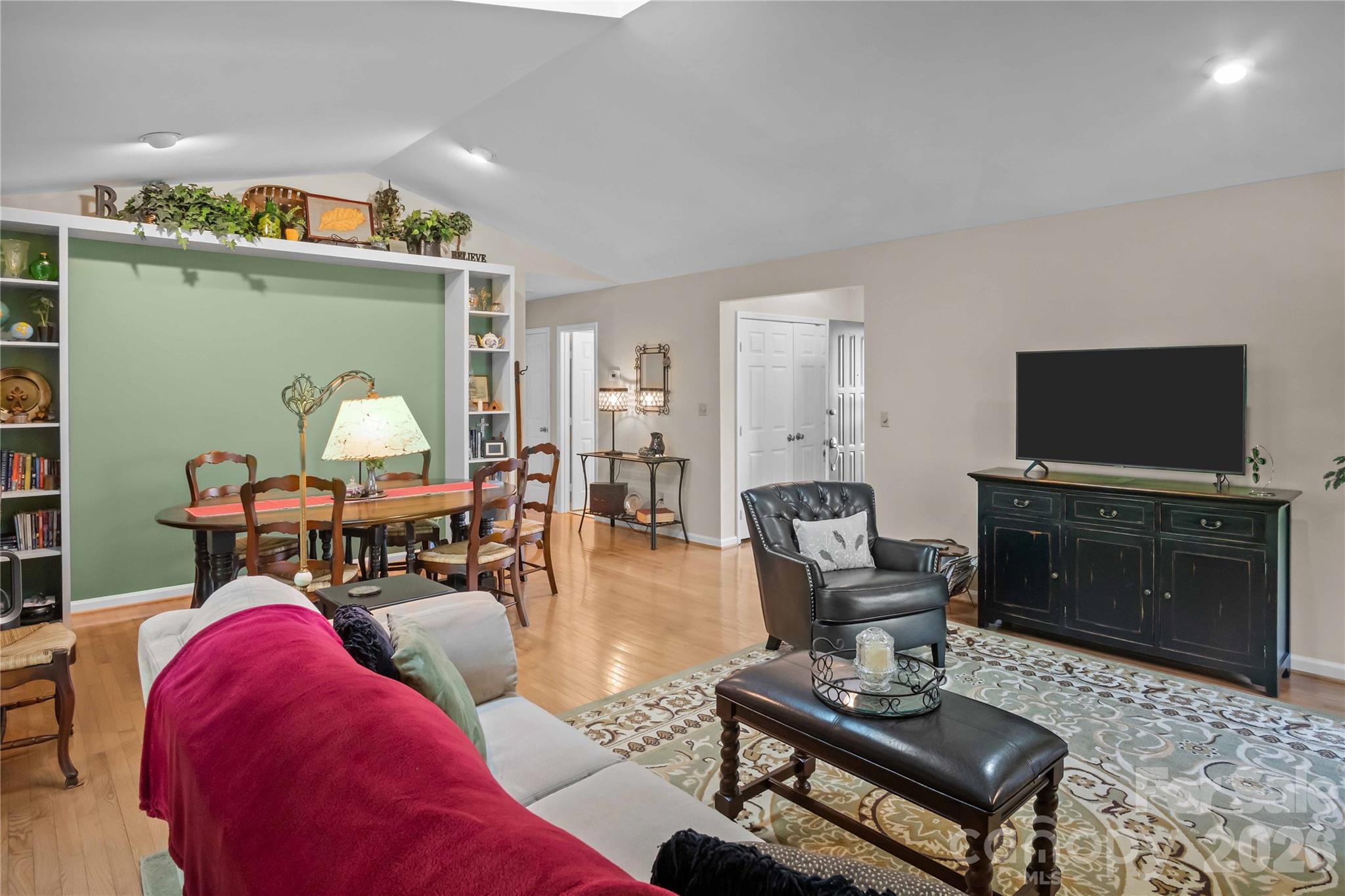 335 Melrose Avenue, Unit 103 Tryon, NC 28782 - Photo 10 of 38 a living room with furniture and a flat screen tv