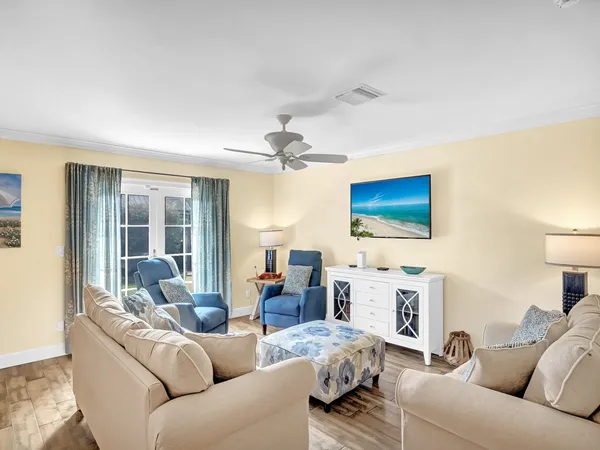 a living room with furniture and a flat screen tv