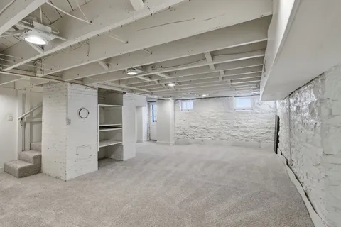 a view of empty room with white walls