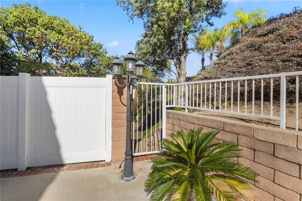 a view of balcony with wooden fence