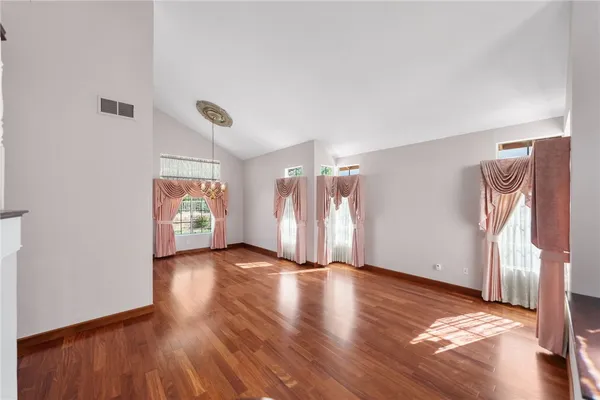 a view of a livingroom with wooden floor