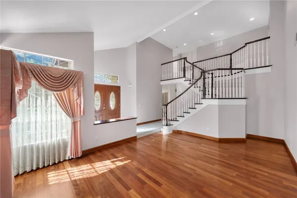 a view of entryway with wooden floor