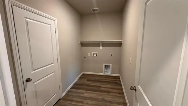 a white toilet sitting next to a sink